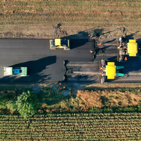 Aerial view on the new asphalt road under construction. Drone photography.