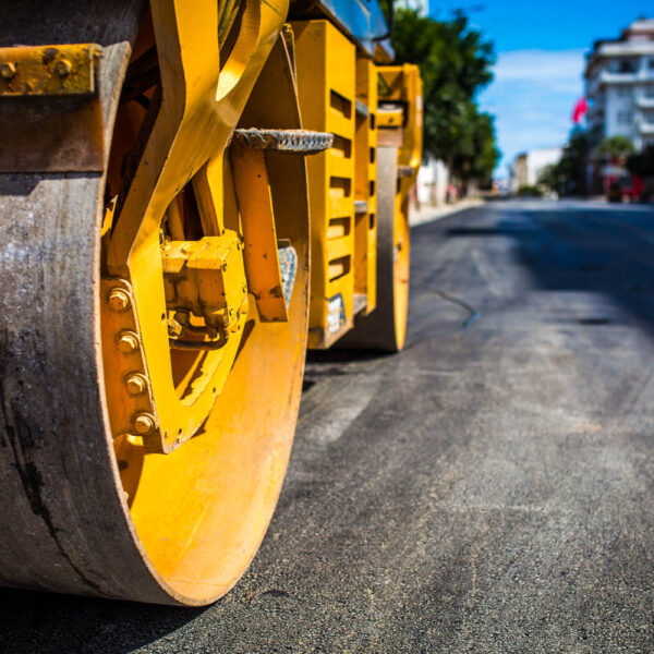 Roadworks, rolling a new layer of the road.