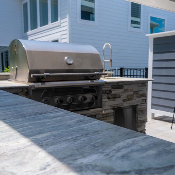 Elevate your outdoor living with custom outdoor kitchens from HCE Site Maintenance, serving Rehoboth, Bethany Beach, Fenwick Island, Lewes, Dewey Beach, the Delaware Beaches, Maryland, and Delmarva. Our expert team designs and installs high-quality outdoor kitchens tailored to your style and needs. Enjoy cooking and entertaining in a beautifully crafted space that combines functionality and aesthetics. Trust HCE to create the perfect outdoor kitchen for your home. HCE Delivers excellence in outdoor kitchen solutions.