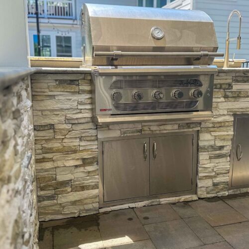 Elevate your outdoor living with custom outdoor kitchens from HCE Site Maintenance, serving Rehoboth, Bethany Beach, Fenwick Island, Lewes, Dewey Beach, the Delaware Beaches, Maryland, and Delmarva. Our expert team designs and installs high-quality outdoor kitchens tailored to your style and needs. Enjoy cooking and entertaining in a beautifully crafted space that combines functionality and aesthetics. Trust HCE to create the perfect outdoor kitchen for your home. HCE Delivers excellence in outdoor kitchen solutions.