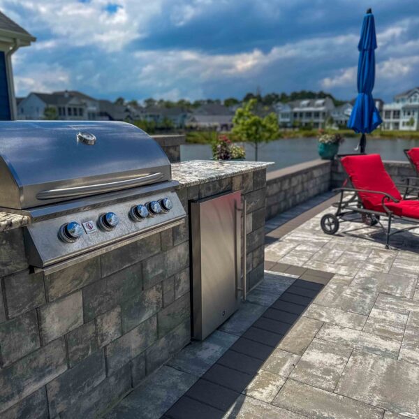 Elevate your outdoor living with custom outdoor kitchens from HCE Site Maintenance, serving Rehoboth, Bethany Beach, Fenwick Island, Lewes, Dewey Beach, the Delaware Beaches, Maryland, and Delmarva. Our expert team designs and installs high-quality outdoor kitchens tailored to your style and needs. Enjoy cooking and entertaining in a beautifully crafted space that combines functionality and aesthetics. Trust HCE to create the perfect outdoor kitchen for your home. HCE Delivers excellence in outdoor kitchen solutions.