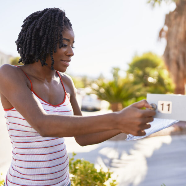 african american woman checking mail in las vegas