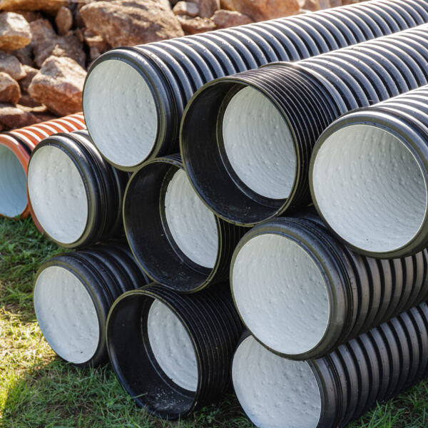 Pile of Polyethylene drainage pipes on outdoors